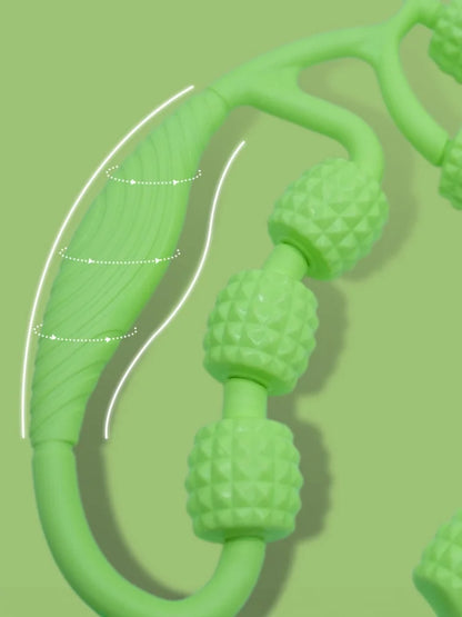 Close-up of a green massage roller handle and textured rollers