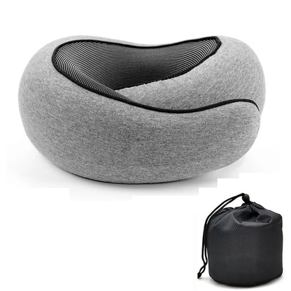A gray contoured travel neck pillow with a black mesh interior, shown alongside its black drawstring storage pouch on a white background.