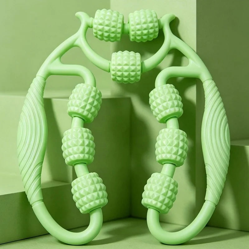 A mint green manual massage roller with textured cylindrical rollers and curved handles, displayed against a matching green geometric background.