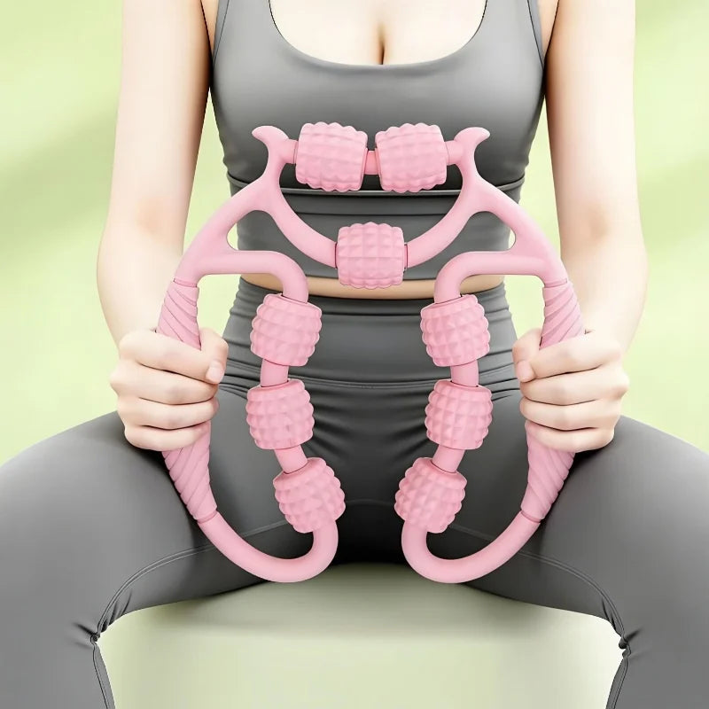 Person holding a pink 9-wheel manual massage roller