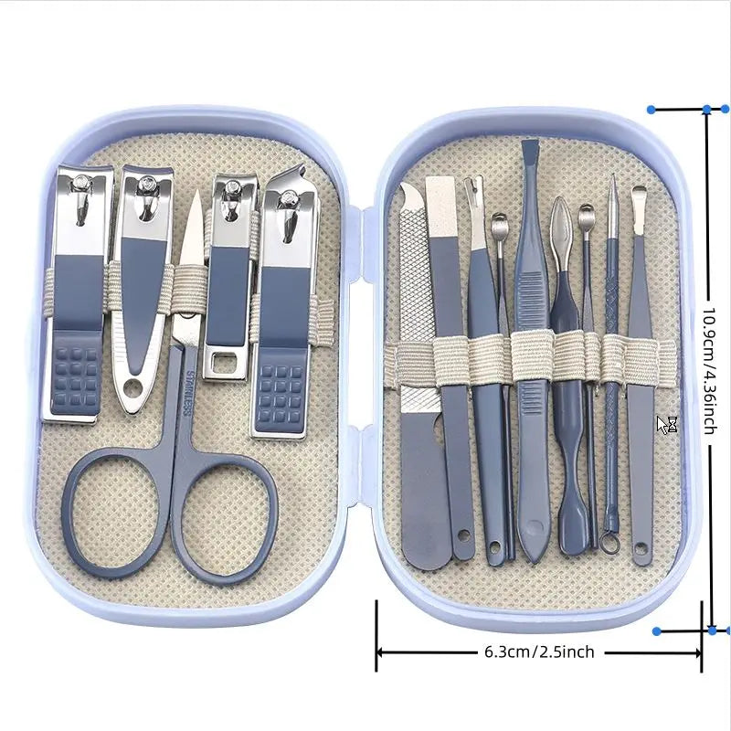 Manicure set with tools and scissors in a case, open to show contents.