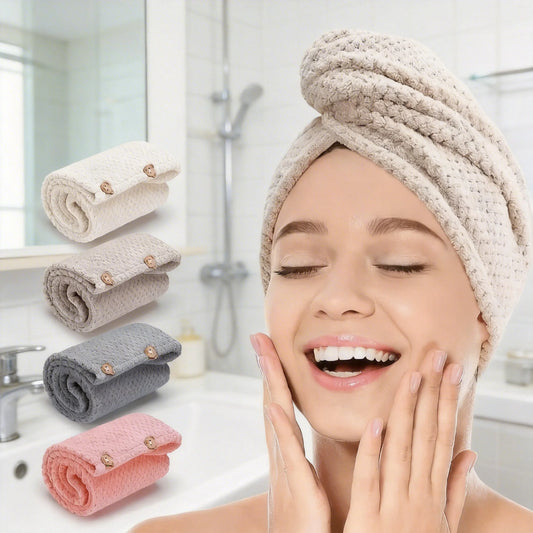 Woman with a towel on her head in a bathroom setting, with rolled-up towels in beige, gray, and pink.