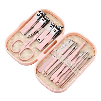 Pink nail care set with scissors and tools in a case on a white background