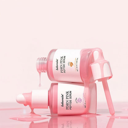 Pink peptide serum bottle with dropper on a light pink background