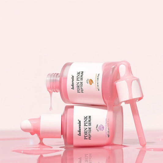 Pink peptide serum bottle with dropper on a light pink background